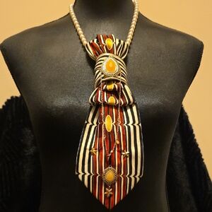 Elegant Striped Necklace with Gold and Pearl Accents